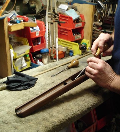 Paul servicing a firearm Paul servicing a firearm